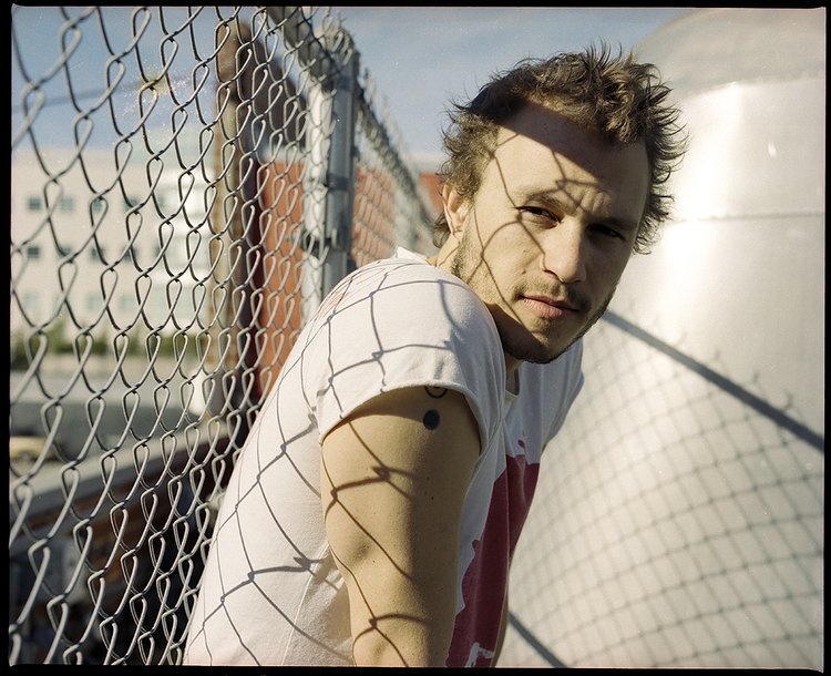 image of late actor Heath Ledger at LA River standing near a fence